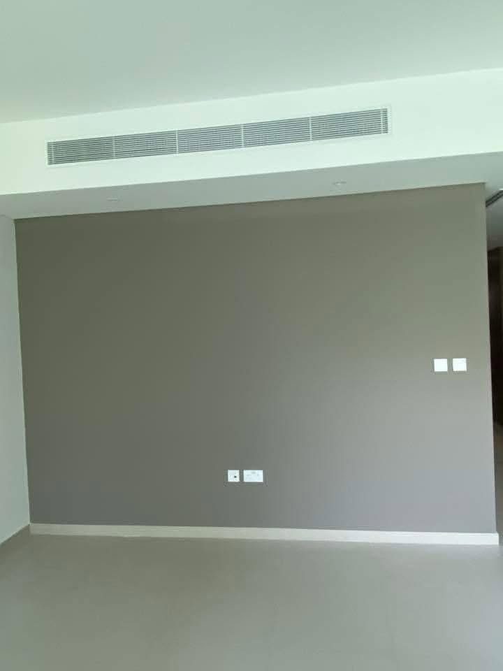Freshly painted wall with a smooth, even white finish